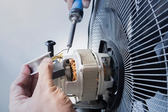 Close-up motor fan Repair and maintenance of home appliances for fixing the fan, nut and wire coppe
