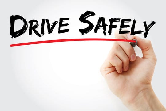Hand writing Drive Safely with marker, concept background
