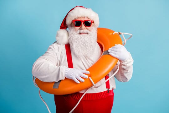 Portrait of his he nice attractive cheerful cheery confident white-haired Santa swimmer sailor weari