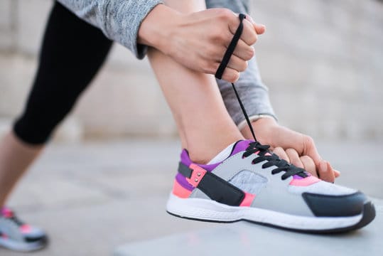 tying shoelaces on sneakers